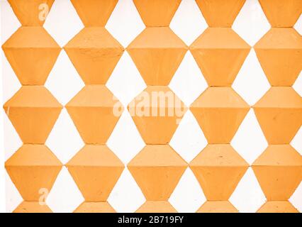 Texture of the painted wall with rhombuses in two colors. Stock Photo