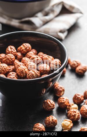 Hazelnuts with sugar icing in bowl. Stock Photo
