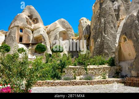 Houses built on the typical rocks formations on the Cappadocia region in Turkey Stock Photo