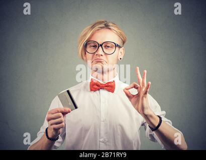 Sly liar salesman reassuring their credit card is the best Stock Photo