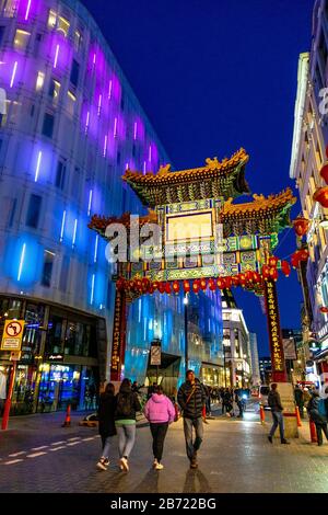 Colourful oriental style gate into Chinatown at night, London, UK Stock Photo