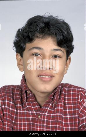 Austin Texas USA: 13-year-old Hispanic boy poses for studio portrait.  MR ©Bob Daemmrich Stock Photo