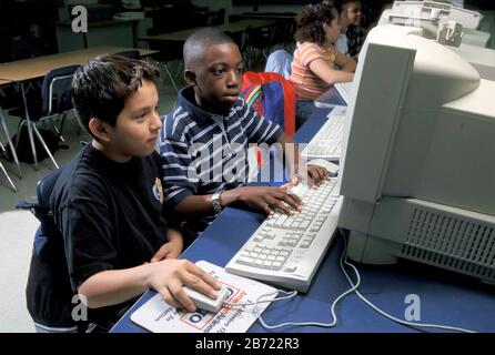 Austin, Texas USA, 2000  Students at Mendez Junior High School working in computer lab. ©Bob Daemmrich Stock Photo