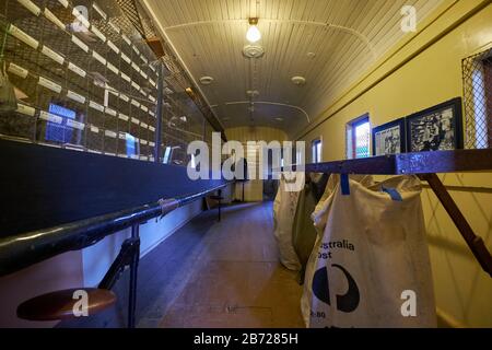 Interior sorting area for letters, packages of a Mail Van rail car at the Roundhouse Railway Museum. In Junee, New South Wales, Australia. Stock Photo