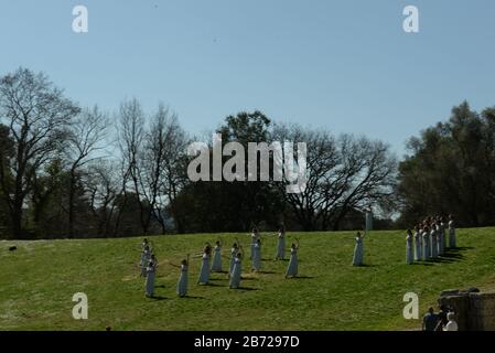 Ancient Olympia, Greece. 12th Mar, 2020. During the ceremony of the torch relay. (Photo by Dimitrios Karvountzis/Pacific Press) Credit: Pacific Press Agency/Alamy Live News Stock Photo