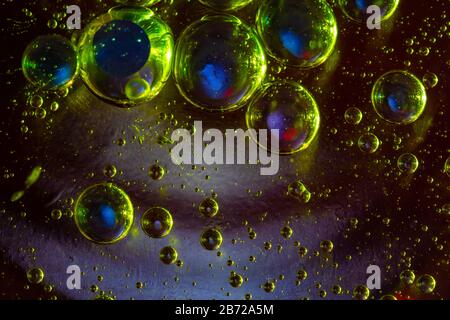 Macro photo of water bubbles suspended in oil Stock Photo