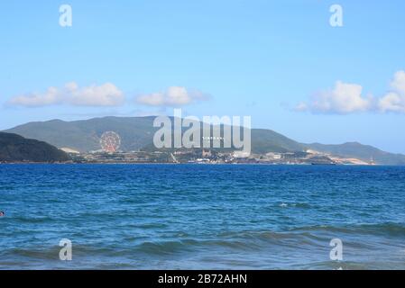 NHA TRANG, VIETNAM – 29 FEBRUARY 2020 : nha trang beach behind is an Vinpearl Land Stock Photo