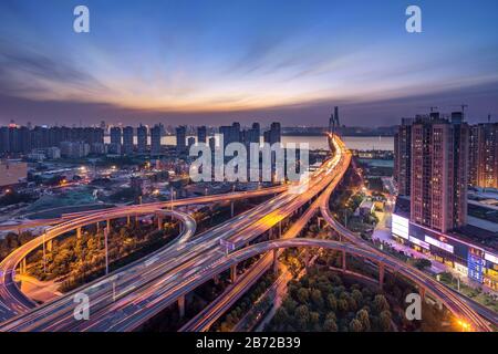Overpass of the light trails, beautiful curves.wuhan Erqi yangtze river bridge at hubei province, China.Aerial view highway road Stock Photo