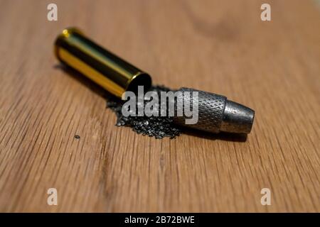 Macro photo of handgun ammunition that has been disassembled into main components Stock Photo