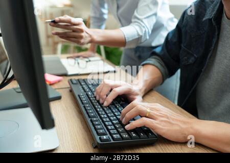 Collaborative work Software engineers website developer technologies or programmer working coding on startup ai application project on screen with par Stock Photo