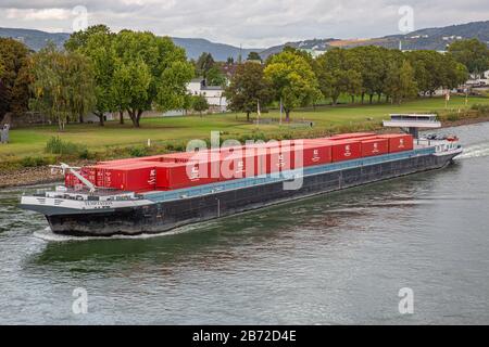 top view from a bridge across the river rhine onto a container ship Stock Photo