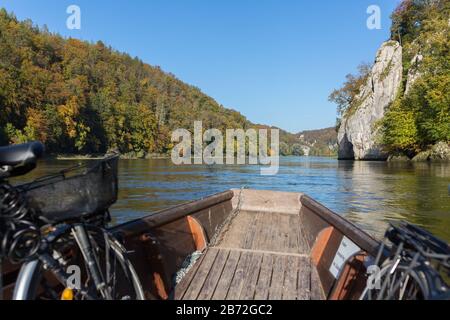 View from a wooden boat cruising at the danube (Donau). Close to the so-called 'Donaudurchbruch' (narrow canyon). Feeling of freedom and adventure. Stock Photo