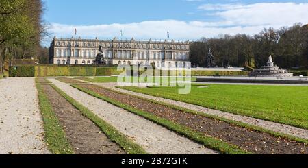 Panorama view on Schloss Herrenchiemsee (palace / castle) with parts of the park in the foreground. Located on an island. Based on Versailles. Stock Photo
