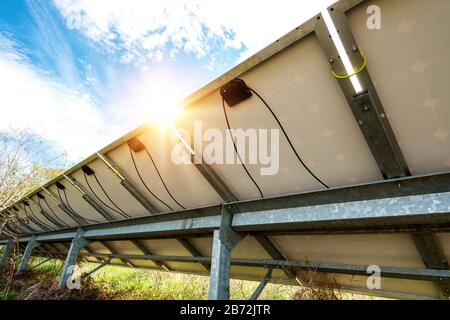 back side view photovoltaics in solar power station - copy space Stock Photo