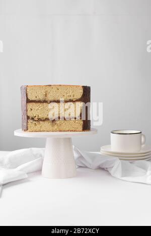 Cross section of an irish whiskey cake with irish cream and a chocolate ganache filling, view of inside a cake, st patrick's day  cake on a white cake Stock Photo
