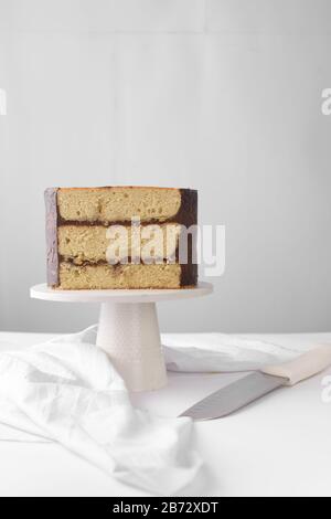 Cross section of an irish whiskey cake with irish cream and a chocolate ganache filling, view of inside a cake, st patrick's day  cake on a white cake Stock Photo