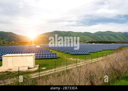 Solar panels, photovoltaics, alternative electricity source. View of a solar station at the foothills of a mountain - concept of sustainable resources Stock Photo