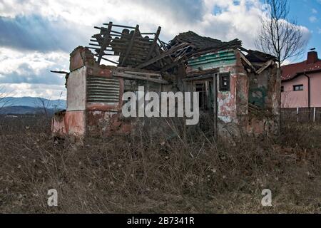 A ruined old ruined house that collapsed. Stock Photo