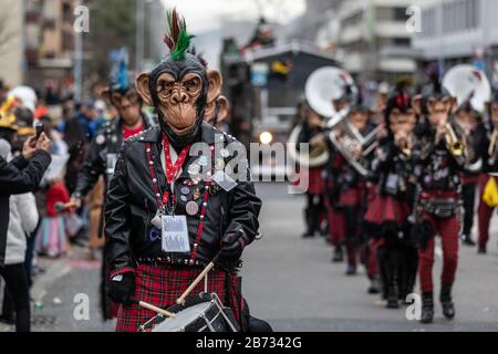 Punky Monkey Guggenmusik Loechlitramper Littau at the carnival procession of the Maettli Guild in Littau, Lucerne, Switzerland Stock Photo