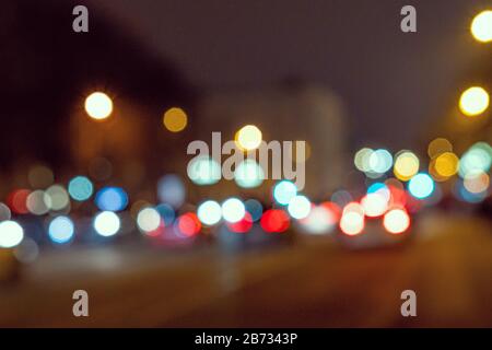 Blurred defocused colorful lights of traffic in the city, the night city with boken Stock Photo