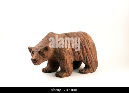 Small wooden sculpture of brown bear Stock Photo