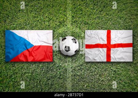 Czech Republic vs. England flags on green soccer field Stock Photo
