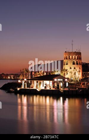 Puerto Banus harbour mouth and watchtower at sunset., Marbella, Spain, Europe. Stock Photo