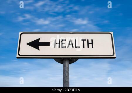 Health road sign, arrow on blue sky background. One way blank road sign with copy space. Arrow on a pole pointing in one direction. Stock Photo