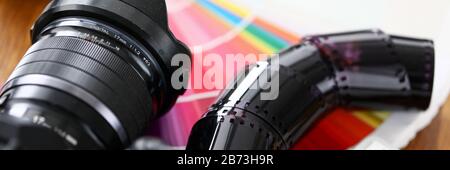 Old film tape laying on colourful fantail with silver keyboard Stock Photo