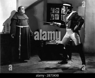 EUGENE PALLETTE as Fray Felipe and BASIL RATHBONE as Captain Esteban Pasquale in THE MARK OF ZORRO 1940 director ROUBEN MAMOULIAN novel Johnston McCulley Twentieth Century Fox Stock Photo