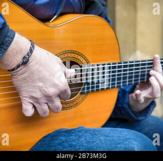 Close up of man playing guitar. Stock Photo