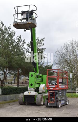 A pair of cherry pickers in Central Milton Keynes Stock Photo