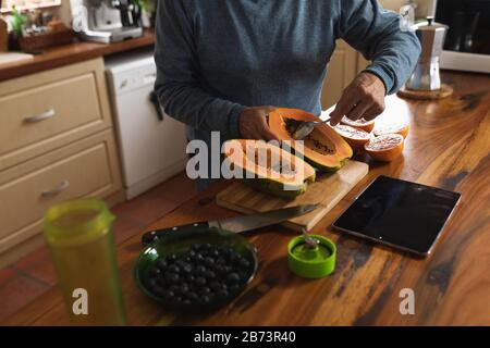 Senior man cooking on his kitchen Stock Photo
