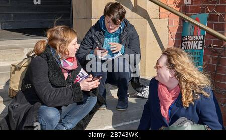 Martha Foulds (R) chatting to protestors over pensions and working conditions outside Firth Court, University of Sheffield Stock Photo