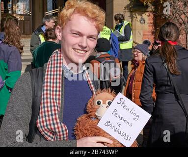 Protestor outside Firth Court, University of Sheffield , with sign mocking staff pension cuts. Stock Photo