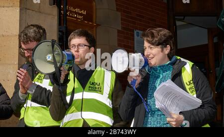 University and College Union strike picket supervisors, one of whom appears to be blowing a raspberry, outside Firth Court, University of Sheffield. Stock Photo