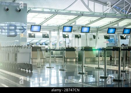 Empty check-in desks at the airport terminal. Stock Photo