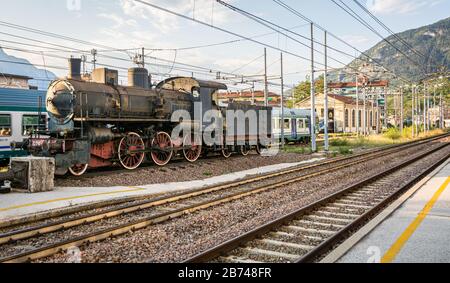 old locomotive (steam engine) on display at the Trento railway station in Trentino Alto Adige. Trento, Italy -  august 19, 2018 Stock Photo