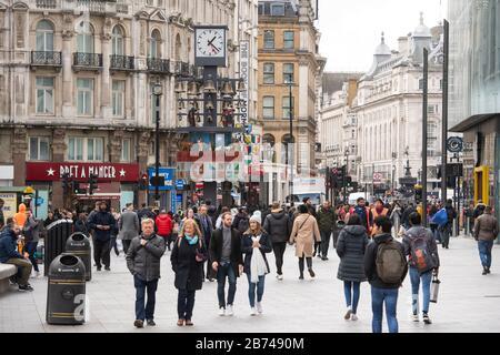 General view of people in Leicester Square, London, as the Government's top scientist warned that up to 10,000 people in the UK are already infected with Covid-19. Stock Photo
