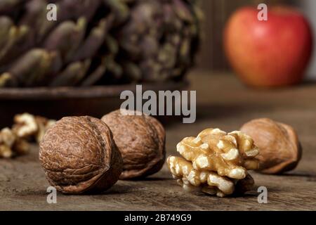 Macro close up of walnuts on a wooden table. Stock Photo