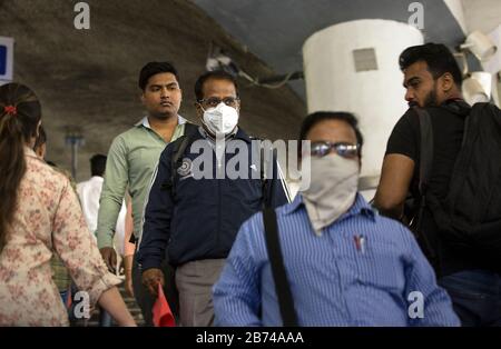 New Delhi, India. 13th Mar, 2020. People wearing masks are seen at a metro station in New Delhi, India, March 13, 2020. The number of the COVID-19 cases in India Friday rose to 81, India's federal health ministry officials said. Credit: Javed Dar/Xinhua/Alamy Live News Stock Photo