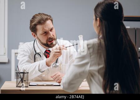 Medical Colleagues Discussing Patient's Treatment and Proper Medication Stock Photo