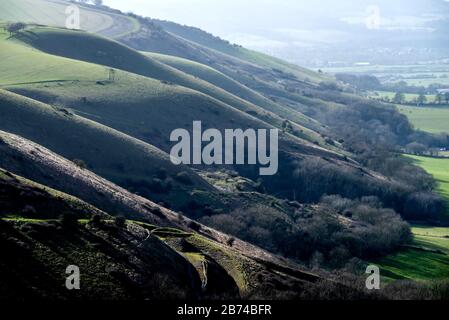 Devil's Dyke, East Sussex, UK. 13th Mar, 2020. Despite the coronavirus outbreak, people on the South Downs enjoyed the beautiful late afternoon light looking out from Devil's Dyke towards the Fulking Escarpment Credit: Andrew Hasson/Alamy Live News Stock Photo