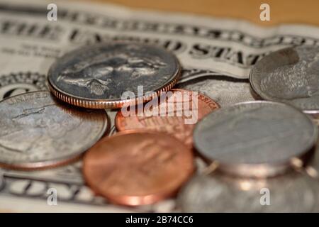 selective focus close up shot of assorted us banknotes and coins Stock Photo