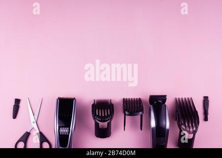 Shaving, Razor, brush, Comb, scissor, clippers and hair trimmer. Accessories for Barber shop equipment on pink background Top view copyspace Stock Photo