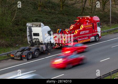 Chorley, Lancashire, UK.  13th March, 2020. Multiple HGV breakdowns on the M6 Motorway lane.  As the efficacy of smart motorways is challenged after 38 deaths in five years after collisions on the hard shoulder. Two HGVS breakdown within 50 yards of each other in Lancashire making for a difficult recovery for Hough Green 24 Hour breakdown rescue service team. Stock Photo