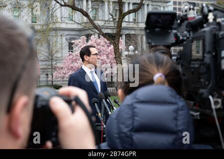 Washington, United States Of America. 13th Mar, 2020. Washington, United States of America. 13 March, 2020. U.S Treasury Secretary Steven Mnuchin speaks to the press on the response to the global outbreak of COVID-19, novel coronavirus outside the West Wing of the White House March 13, 2020 in Washington, DC. Credit: Keegan Barber/White House Photo/Alamy Live News Stock Photo