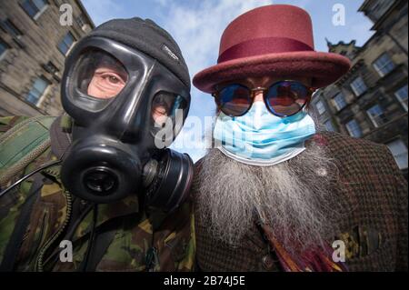 Edinburgh, UK. 13th Mar, 2020. Pictured: (left) Alan Wilson; (right), Jimmy Crombie, wearing personal protective equipment anticipating the ensuing pandemic which is about to hit Scotland. Credit: Colin Fisher/Alamy Live News Stock Photo