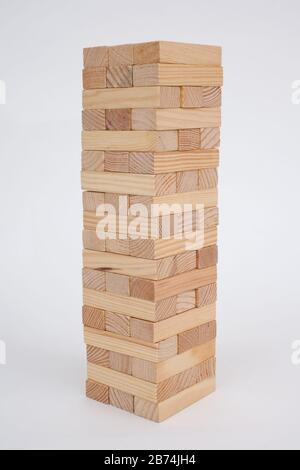 A game with wooden bricks where you have to remove them without knocking it over Stock Photo