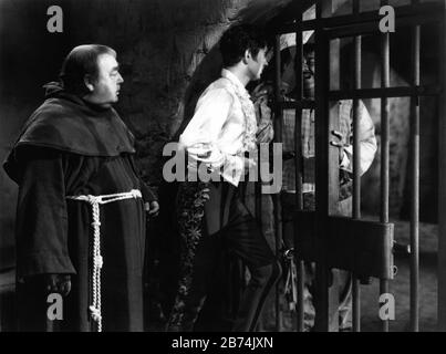 EUGENE PALLETTE as Fray Felipe TYRONE POWER as Diego Vega aka Zorro and CHRIS PIN - MARTIN as Turnkey in THE MARK OF ZORRO 1940 director ROUBEN MAMOULIAN novel Johnston McCulley Twentieth Century Fox Stock Photo